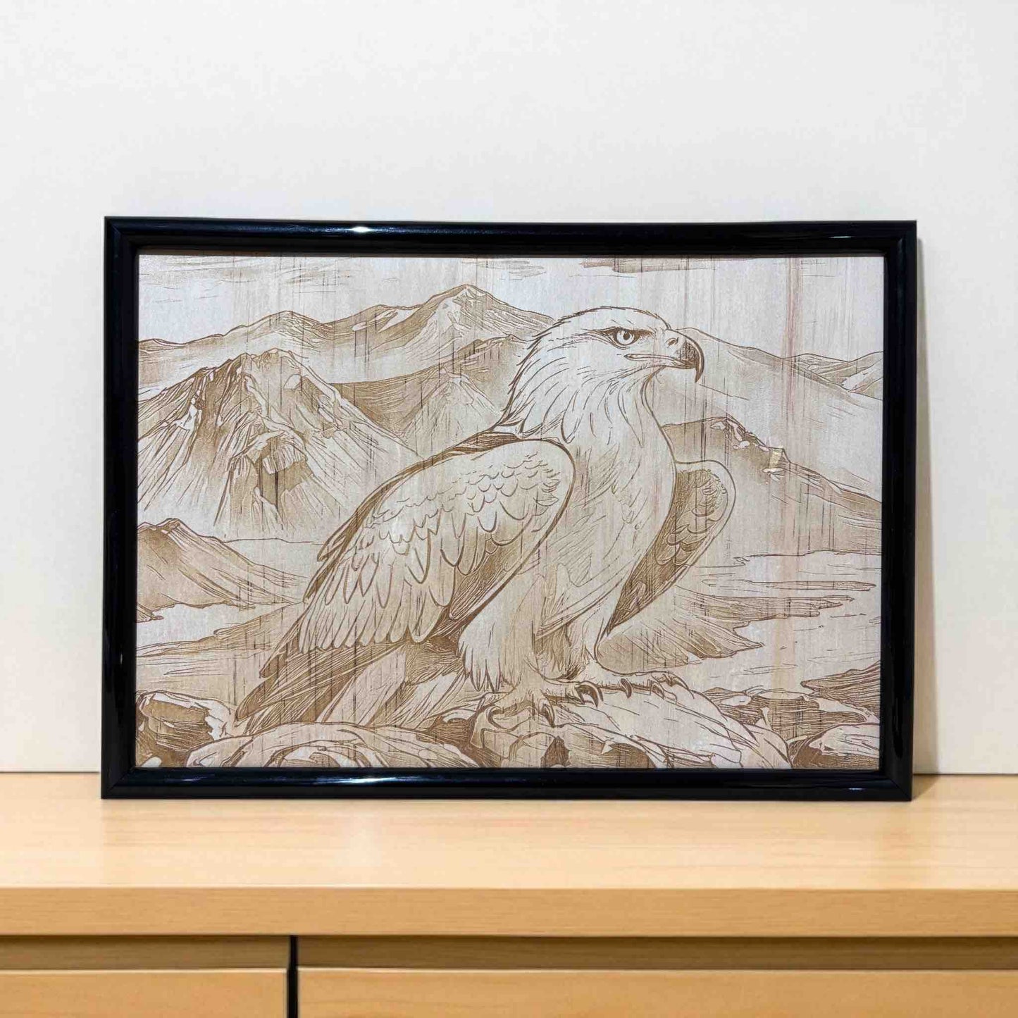 Framed artwork of an eagle with mountain landscape