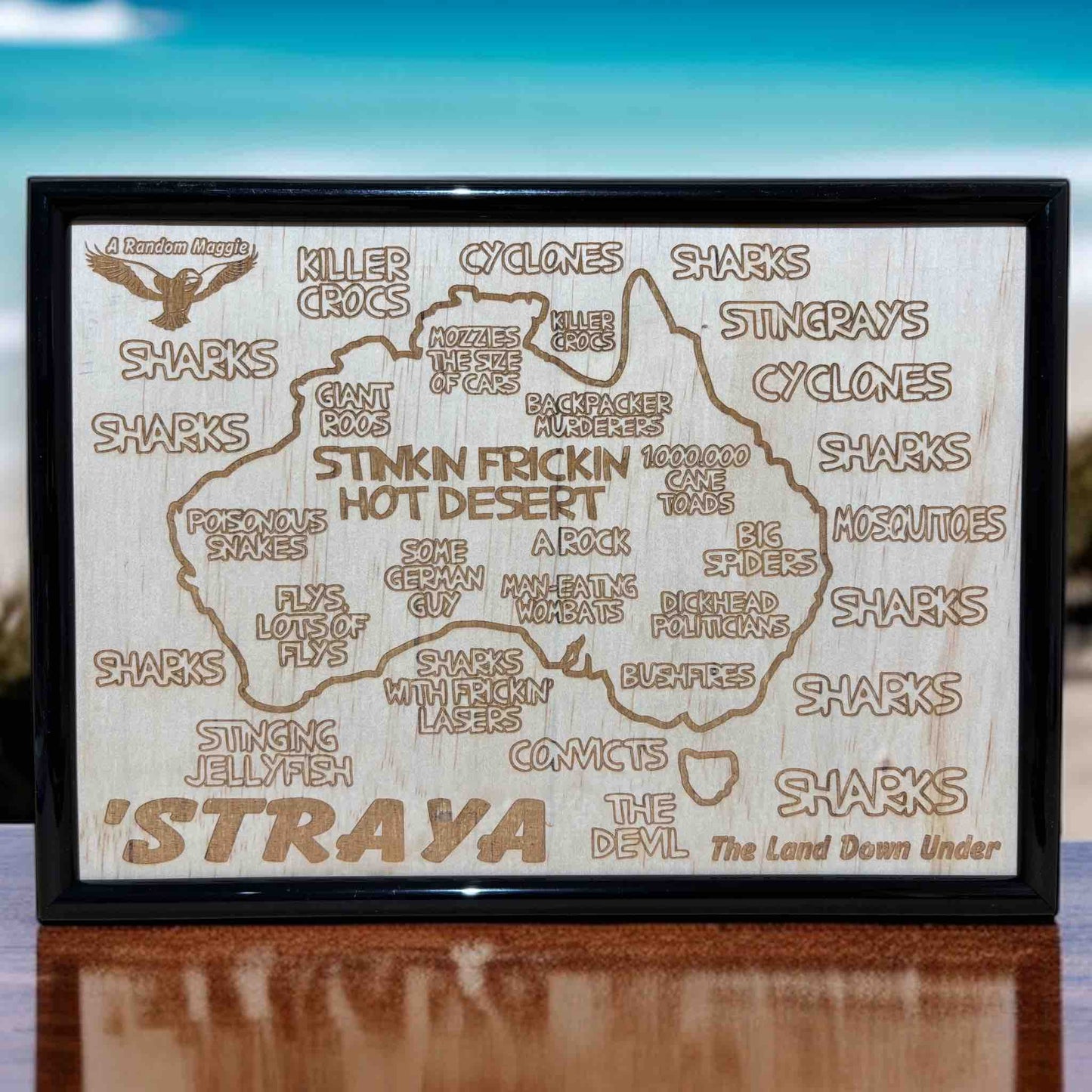 Australia map wood engraved sign displayed on wooden table with scenic background, humorous, funny Aussie gift, Laser Design Creations, Australia.