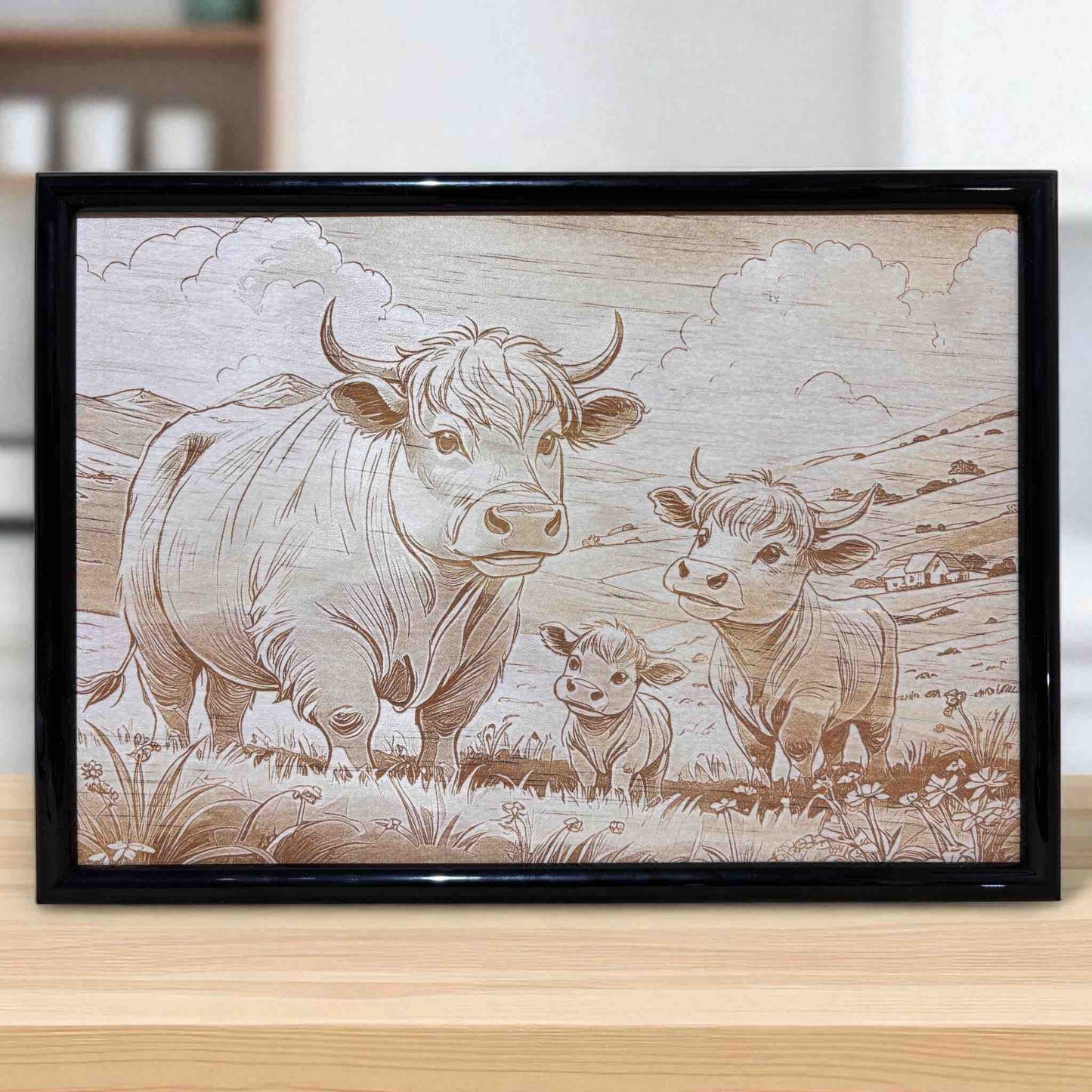 Lifestyle photo of Highland cow family wood engraved art by Laser Design Creations.