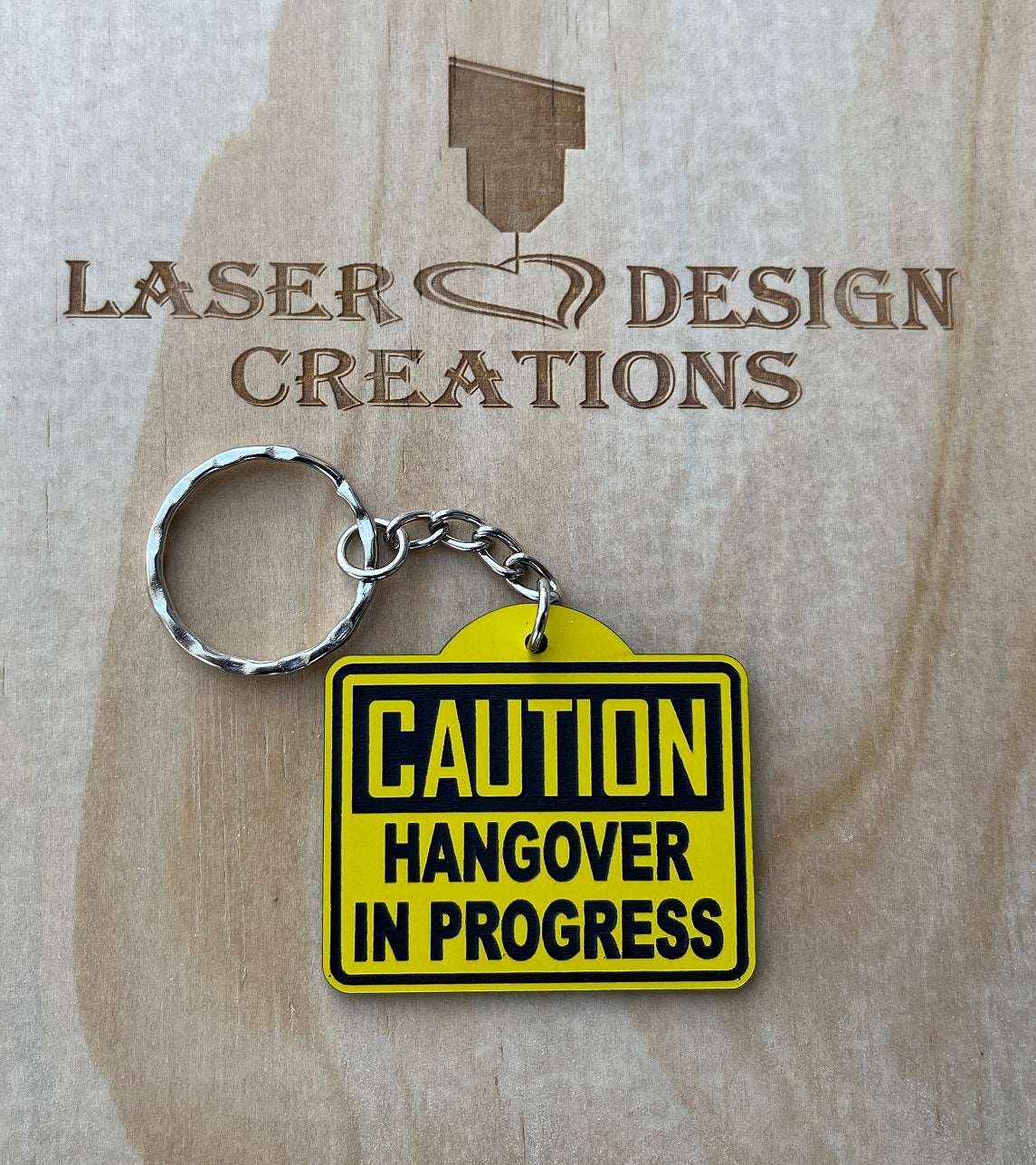 'CAUTION Hangover in Progress' Warning Sign Theme Keyring - Laser Design Creations
