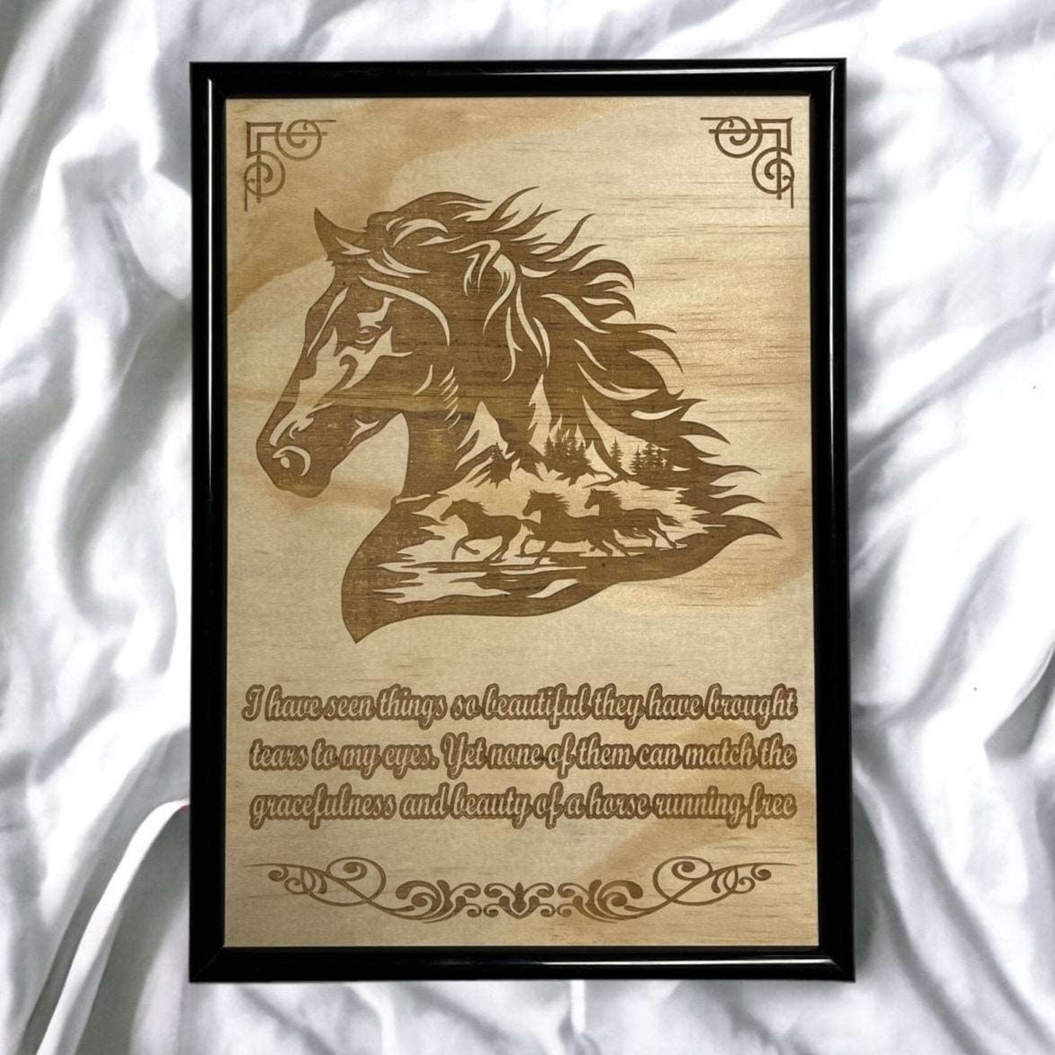 Wooden plaque with horse design and engraved text on a white fabric background