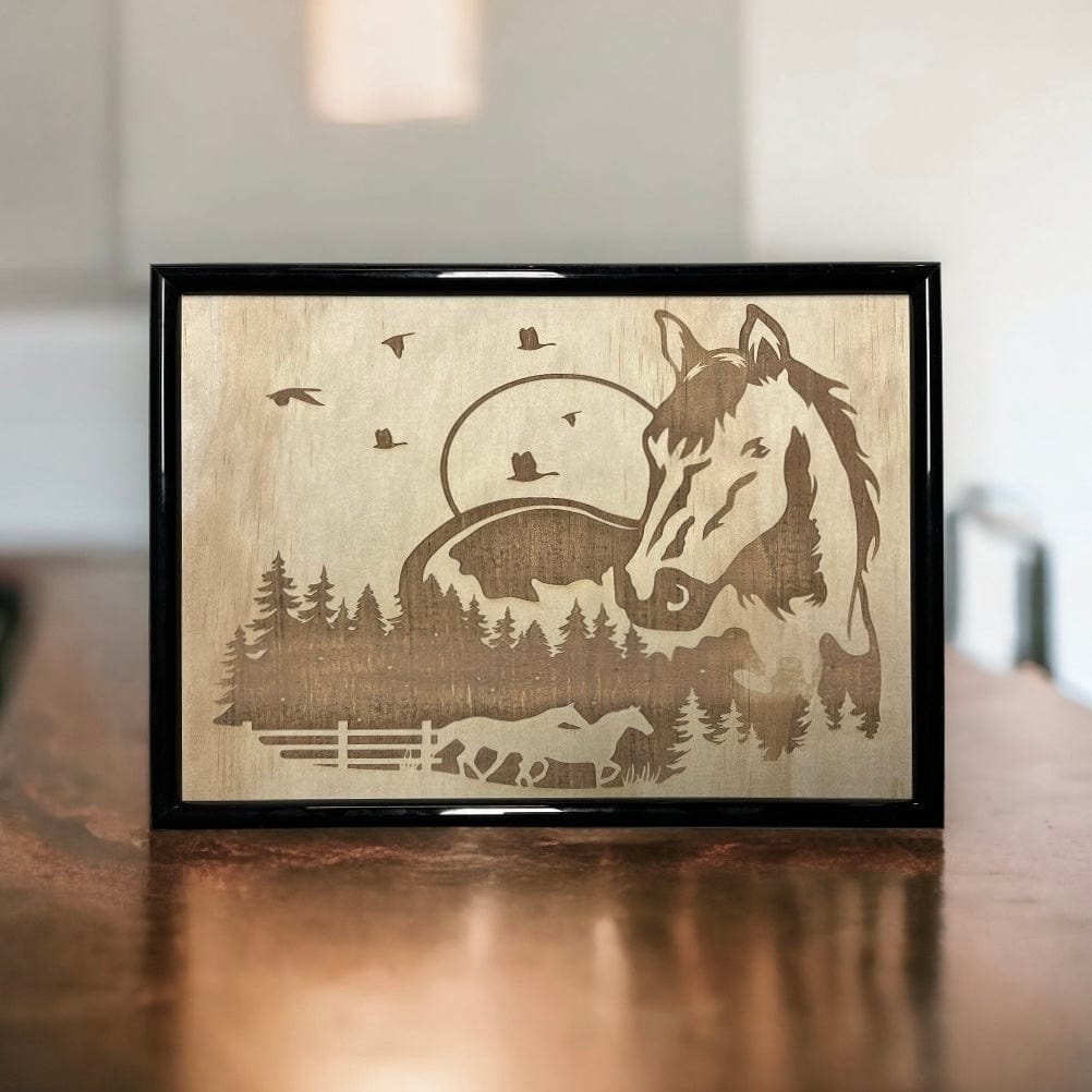 A framed wood engraved artwork featuring a horse motif with a landscape background,Australian Made. Laser Design Creations.