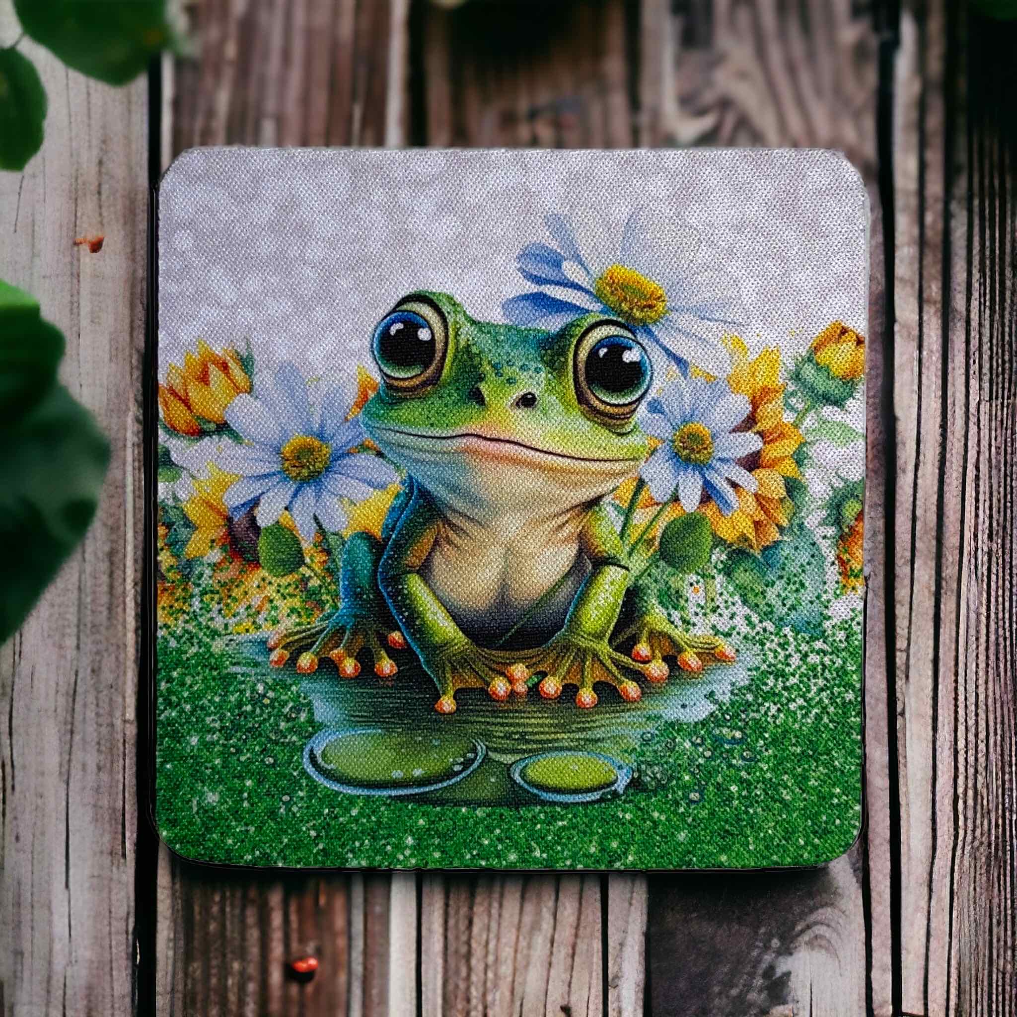 Charming frog in flower pond neoprene coasters by Laser Design Creations, featuring a cute green frog with big eyes surrounded by daisies.