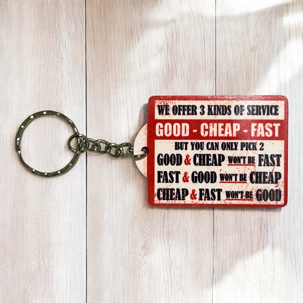 Three Kinds Service Good Cheap Fast acrylic keyring by Laser Design Creations, featuring the ironic service choices quote in a retro industrial design.