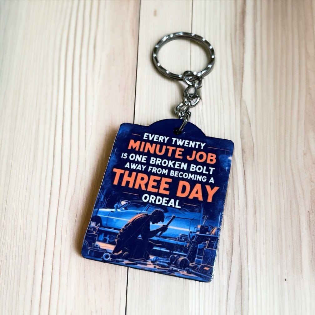 Side view of the Funny Broken Bolt Job Ordeal keyring, showcasing retro mechanic humour and the twenty minute job quote by Laser Design Creations.