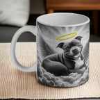 Staffy Angel Memorial ceramic mug, with artwork of a blue (grey) Staffordshire Bull Terrier peacefully resting on a cloud with angel wings by Laser Design Creations.