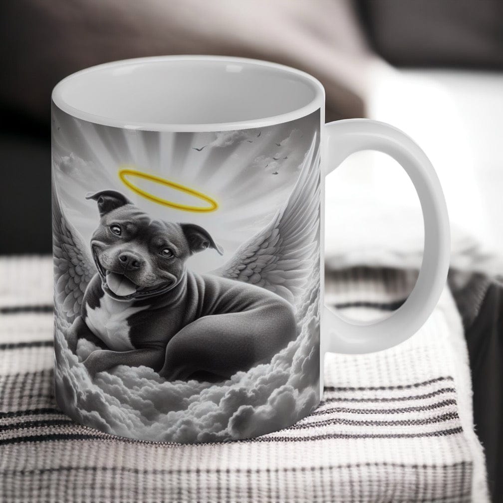 Reverse side of Staffy Angel Memorial ceramic mug, with artwork of a blue (grey) Staffordshire Bull Terrier peacefully resting on a cloud with angel wings by Laser Design Creations.