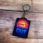 Side view of Born to Stand Out Radiant Design acrylic keyring, showcasing 'BORN TO STAND OUT' text in a bold, vibrant, inspiring style by Laser Design Creations.