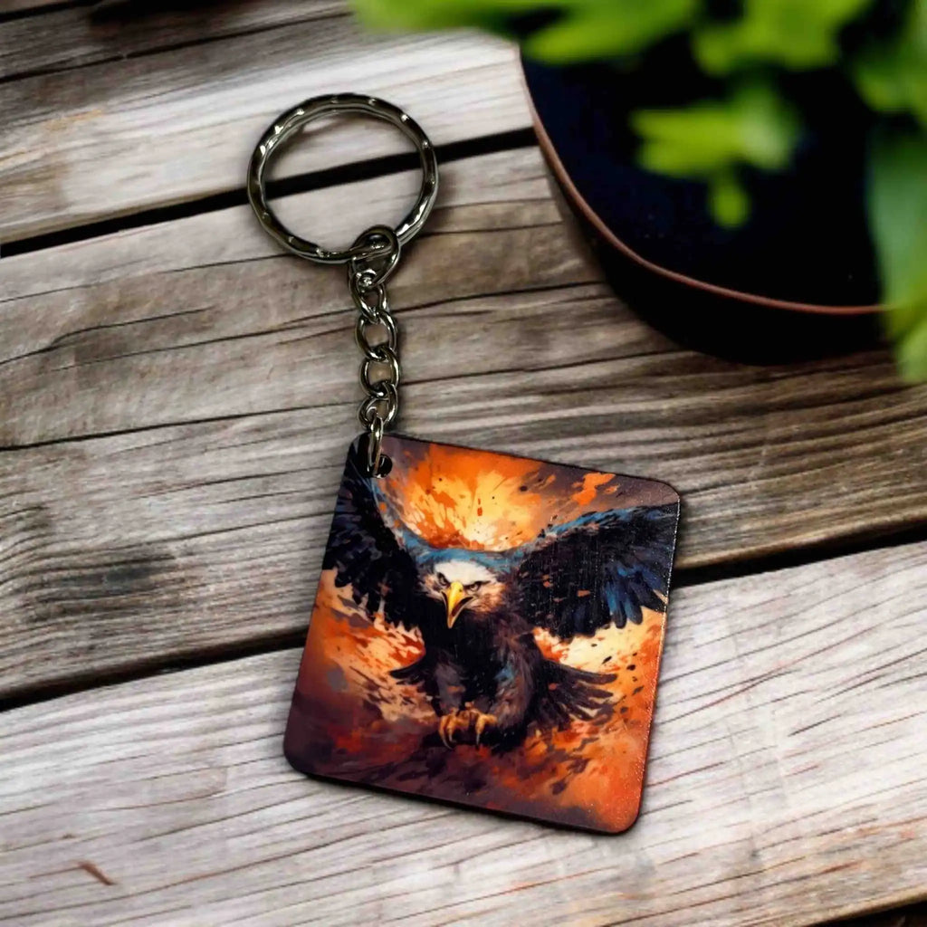 Side view of Fiery Eagle Collection keyring by Laser Design Creations, featuring a painterly eagle in an intense, swooping dive against a fiery background.