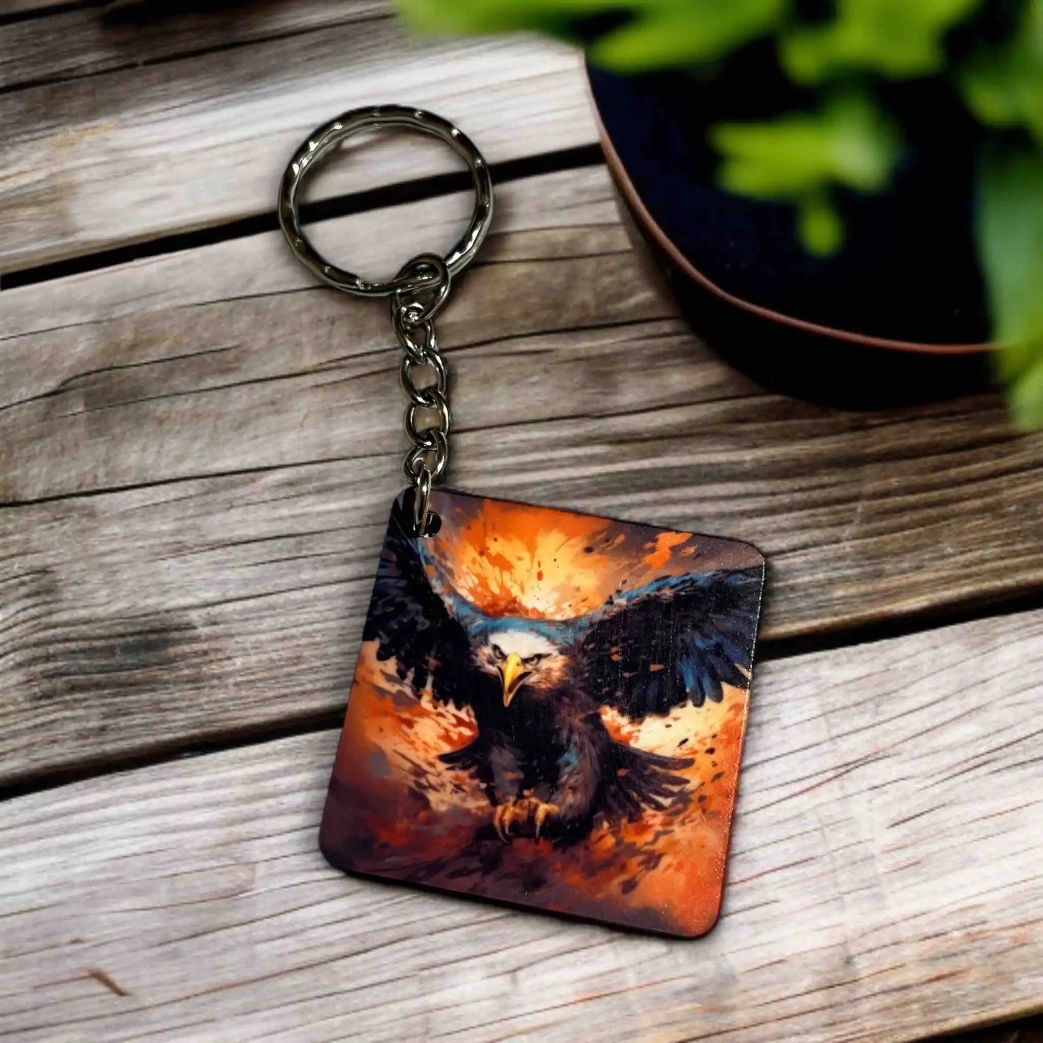 Side view of Fiery Eagle Collection keyring by Laser Design Creations, featuring a painterly eagle in an intense, swooping dive against a fiery background.