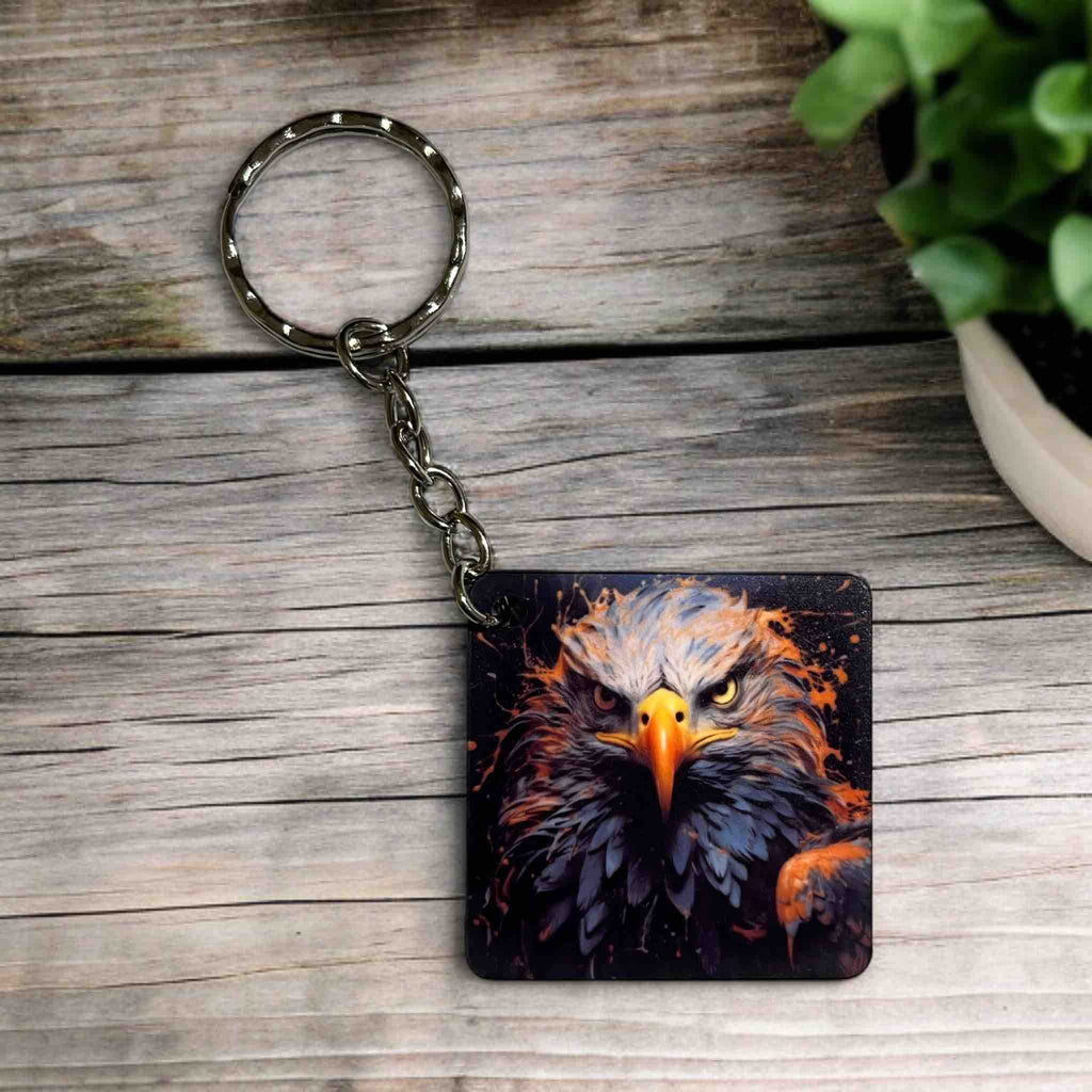 A Fiery Eagle Collection keyring, showcasing a regal, artistic portrait of an eagle's head with intense eyes by Laser Design Creations.