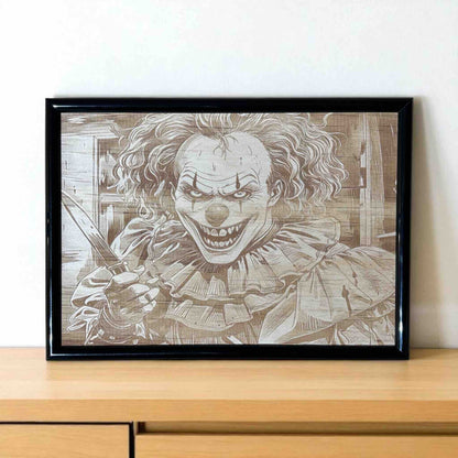 Framed artwork of a clown with a knife on a wooden surface