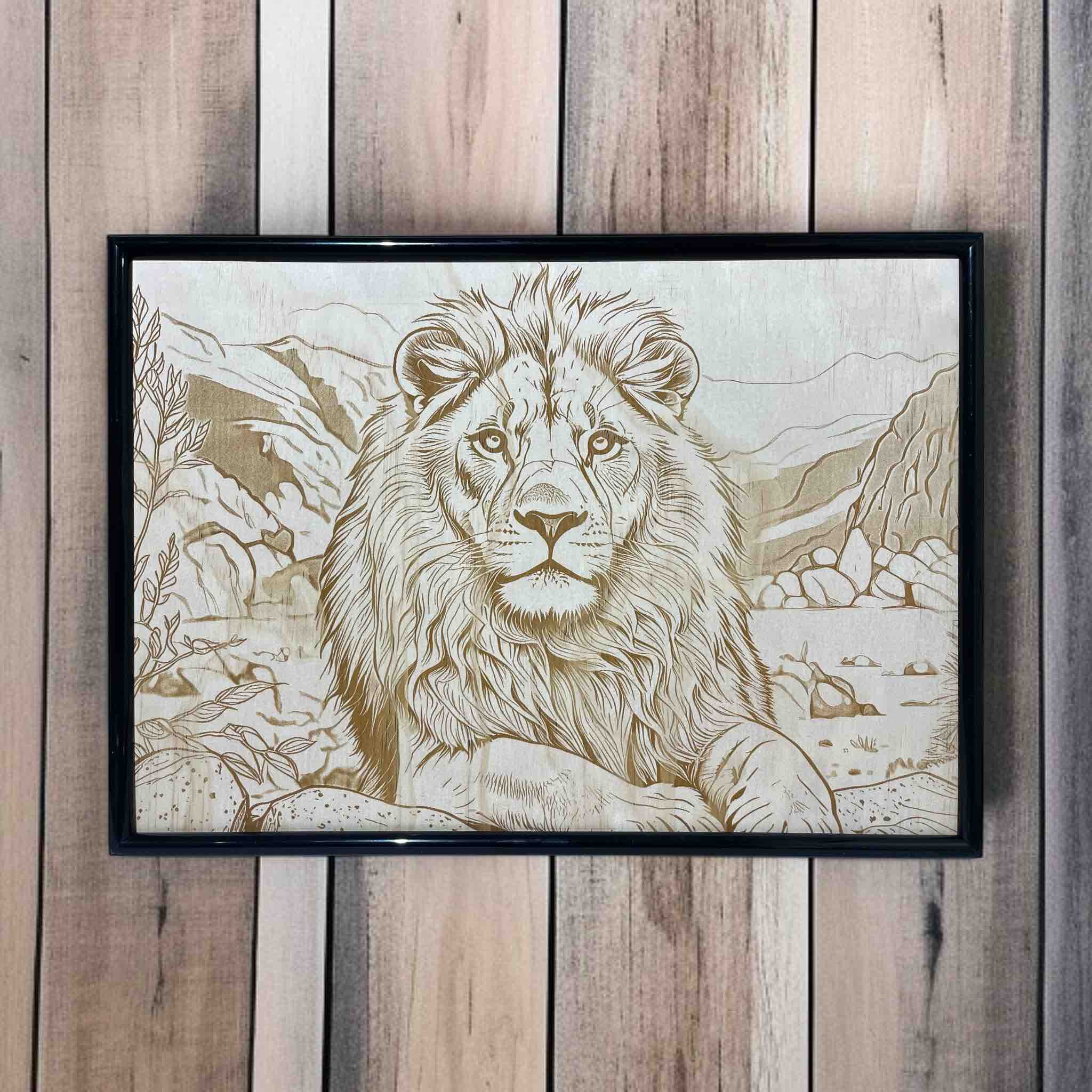 Framed artwork of a lion with a mountainous landscape on a wooden wall.