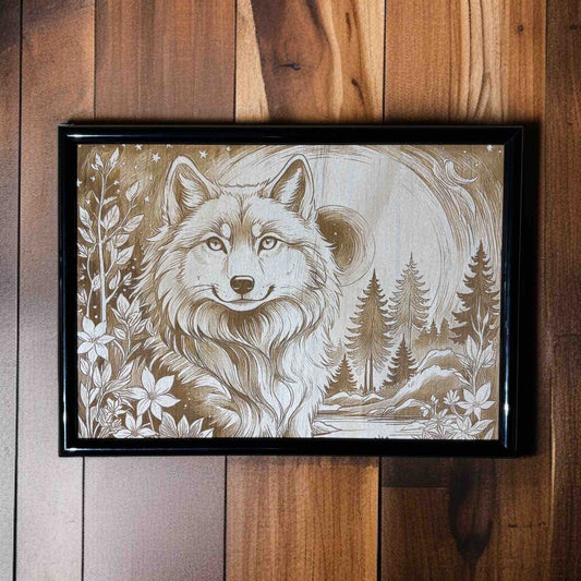 Framed artwork of a wolf with nature elements on a wooden wall.