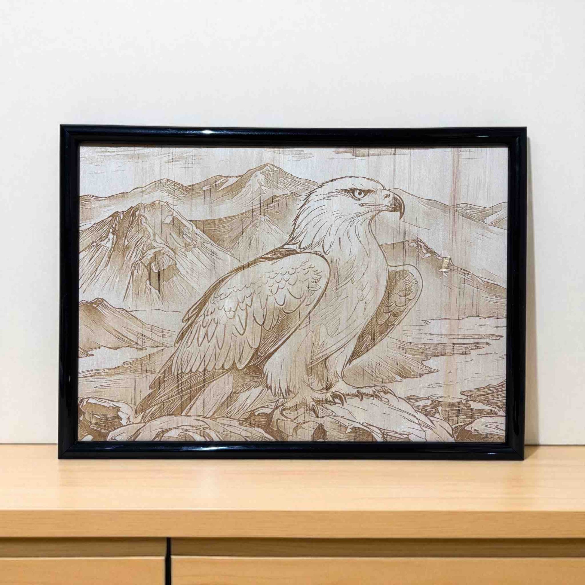 Framed artwork of an eagle with mountain landscape