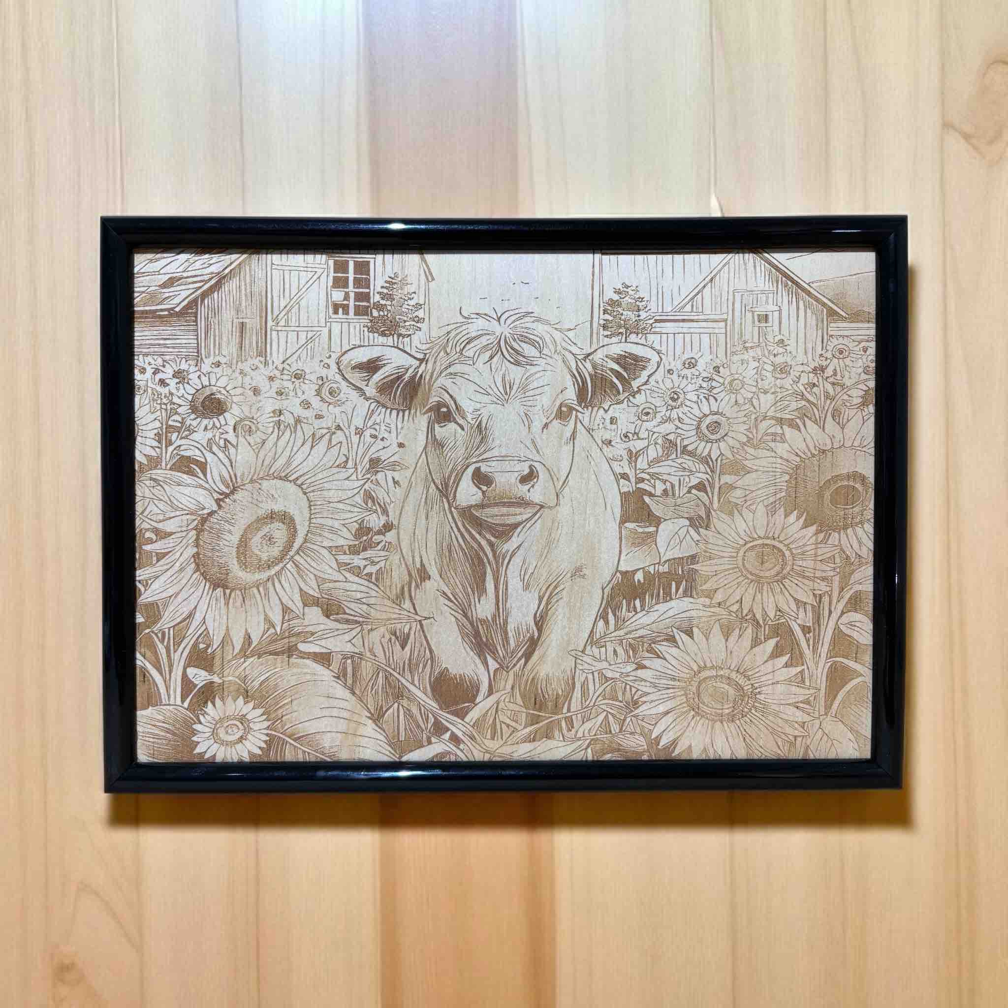 Cow in sunflower field wood engraved art in black frame, farmhouse decor by Laser Design Creations, Australia.