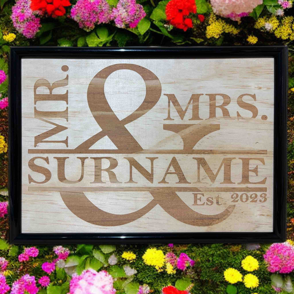 Personalised Mr & Mrs wood engraved art sign displayed in flowers, rustic wedding decor, Laser Design Creations, Australia.