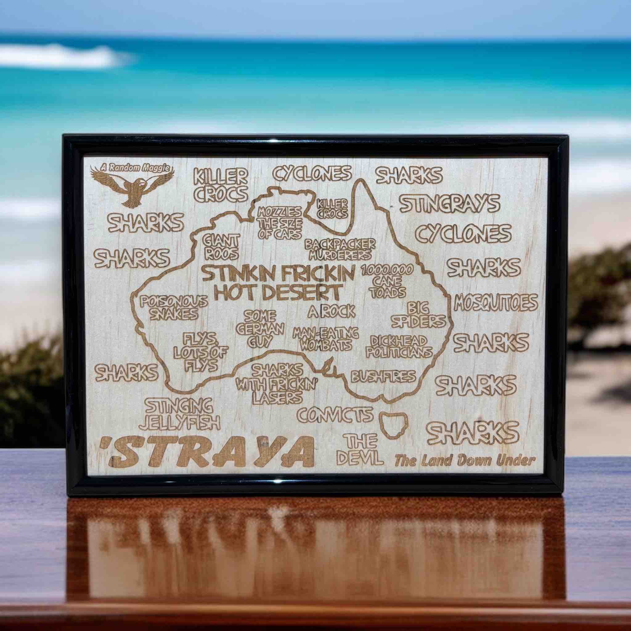 Australia map wood engraved sign displayed on wooden table with scenic background, humorous Aussie gift, Laser Design Creations, Australia.