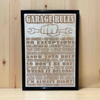 Garage Rules wood engraved sign displayed on grey workbench, humorous shed and workshop wall decor, Laser Design Creations, Australia.