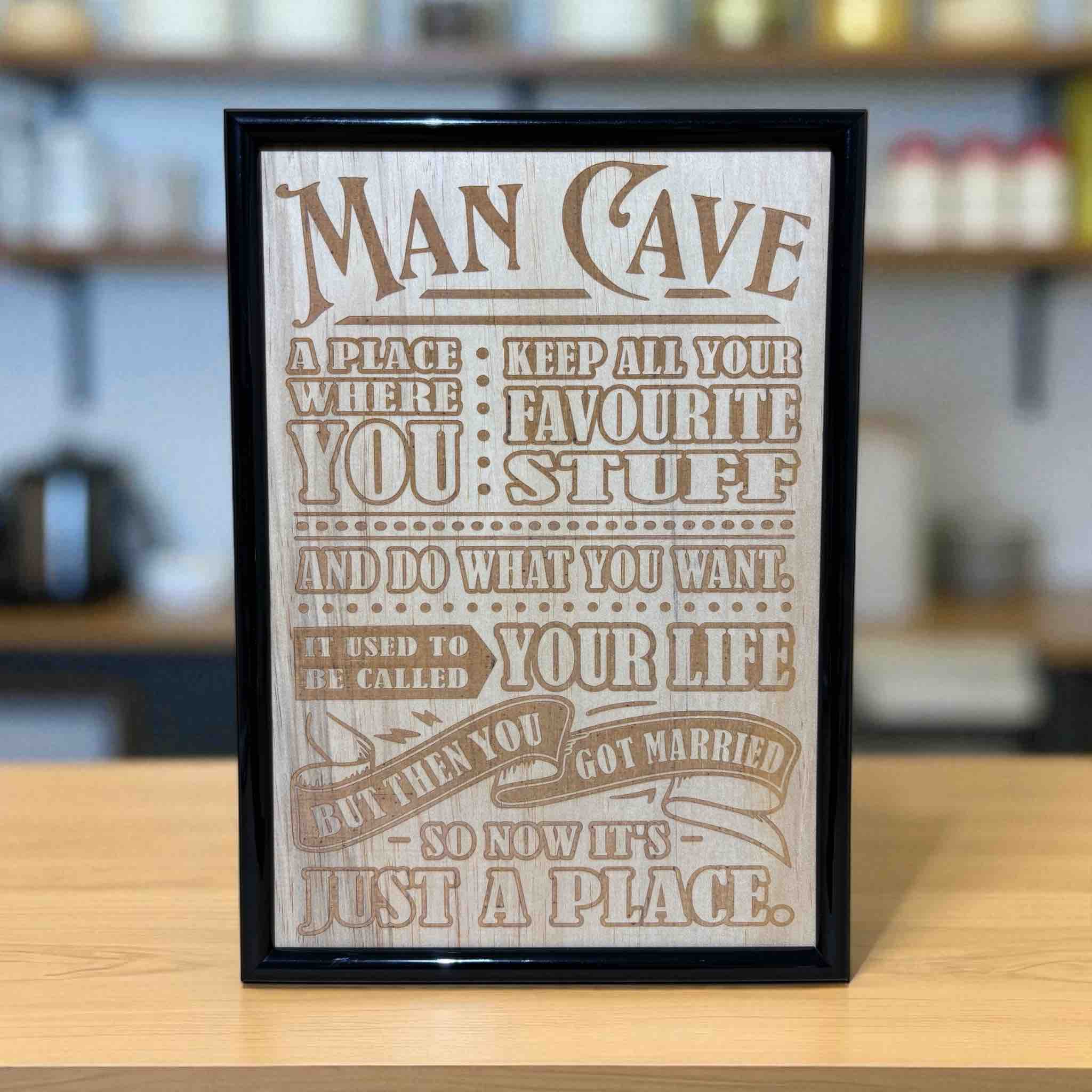 Man Cave wood engraved sign displayed on bar counter, funny, humorous home bar wall art, Laser Design Creations, Australia.