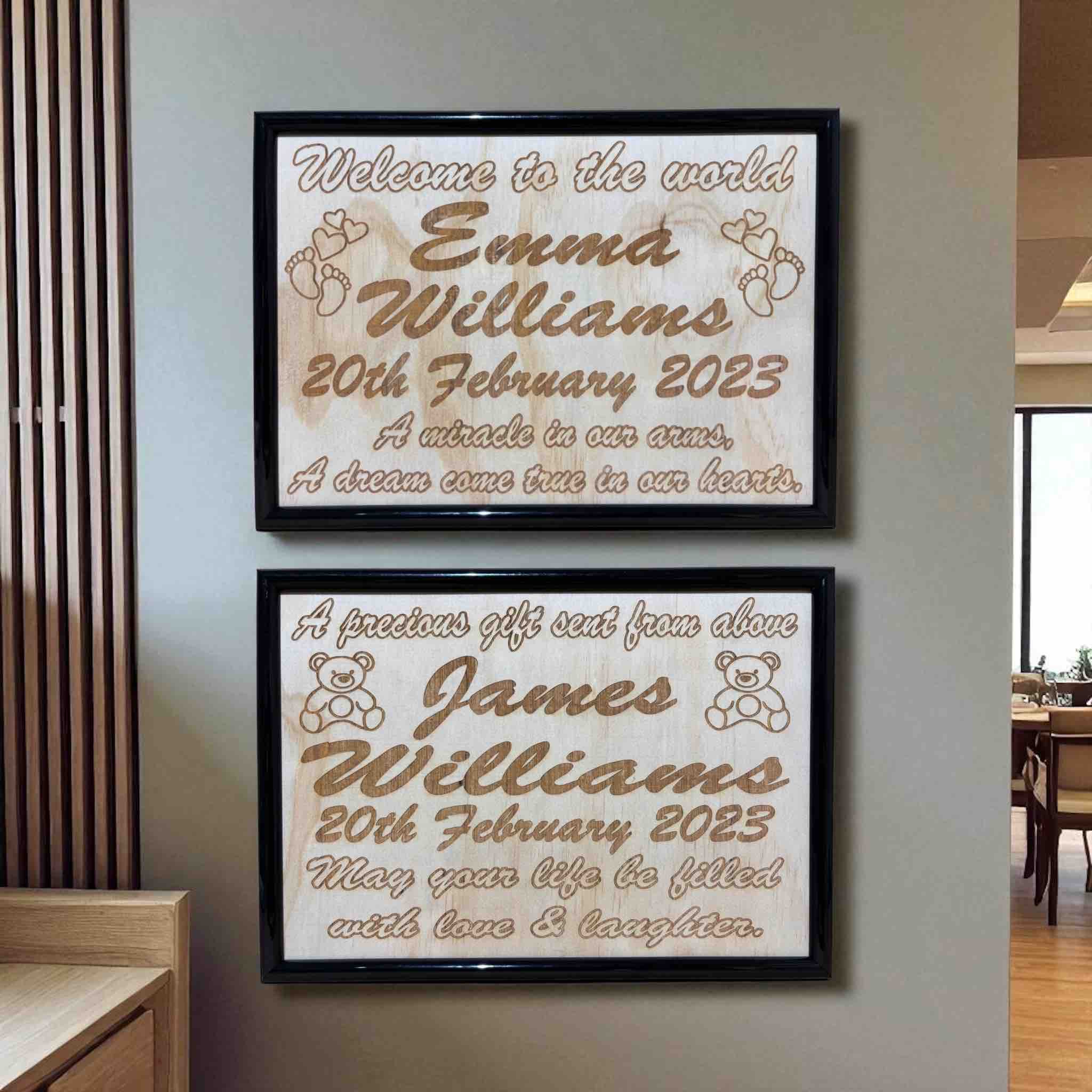 Two wooden framed personalized baby announcement designs hanging on a wall, featuring engraved text with examples of personalized names and birth dates. Aussie made. Laser Design Creations