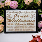 Wooden framed personalised baby announcement art design, featuring engraved text with examples of personalized names and birth dates. Australian made. Laser Design Creations