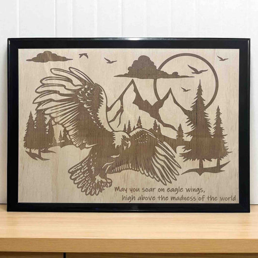 Wood engraved design featuring an eagle flying above a mountain range with a quote printed on it, Australian Made. Laser Design Creations.