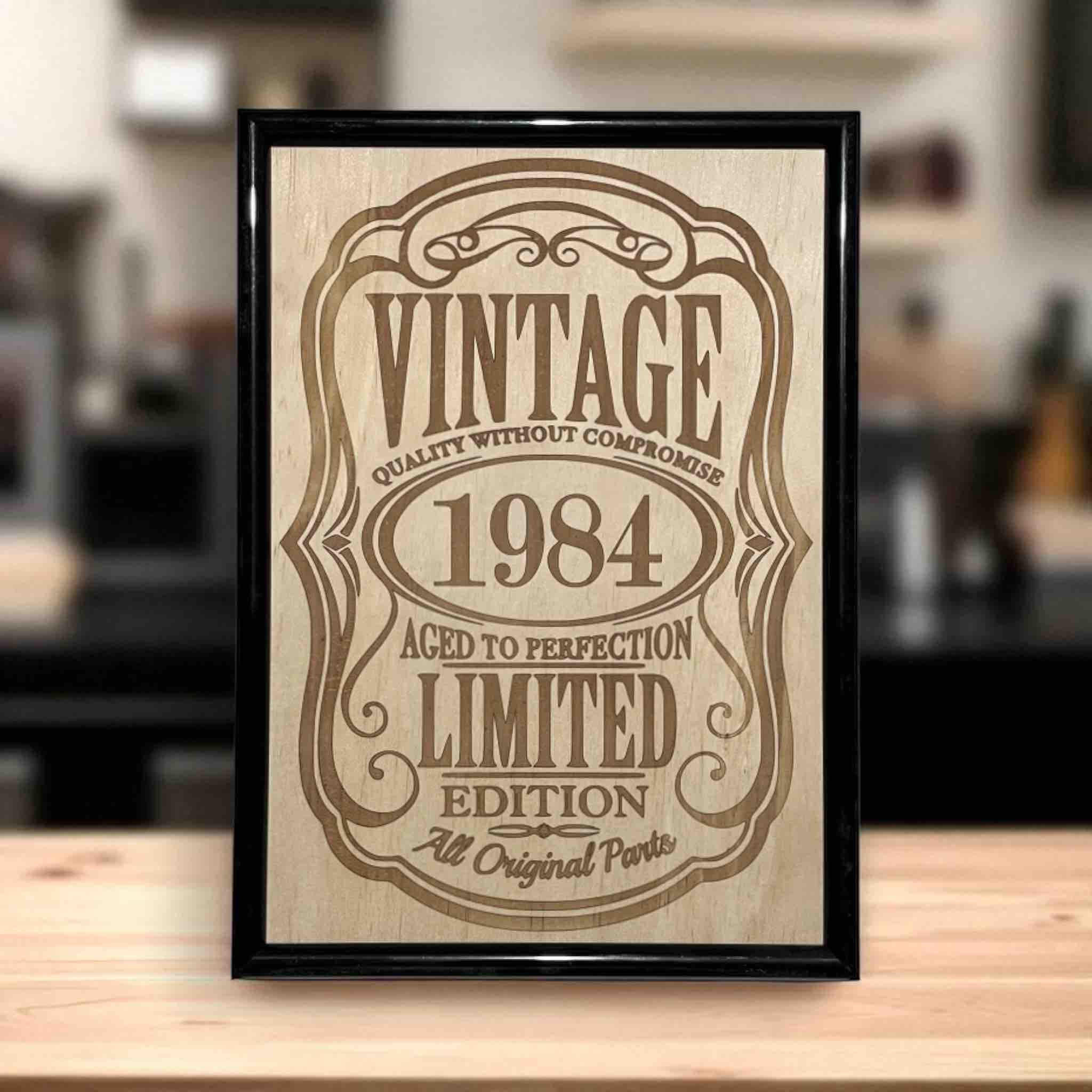 Vintage year wood engraved sign with “Aged to Perfection” design displayed on kitchen table, custom milestone wall art, Laser Design Creations, Australia.