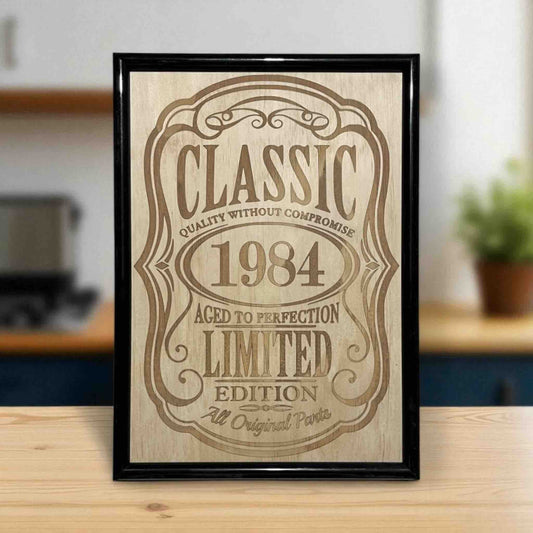 Classic year wood engraved sign with “Aged to Perfection” design displayed on kitchen table, custom milestone wall art, Laser Design Creations, Australia.