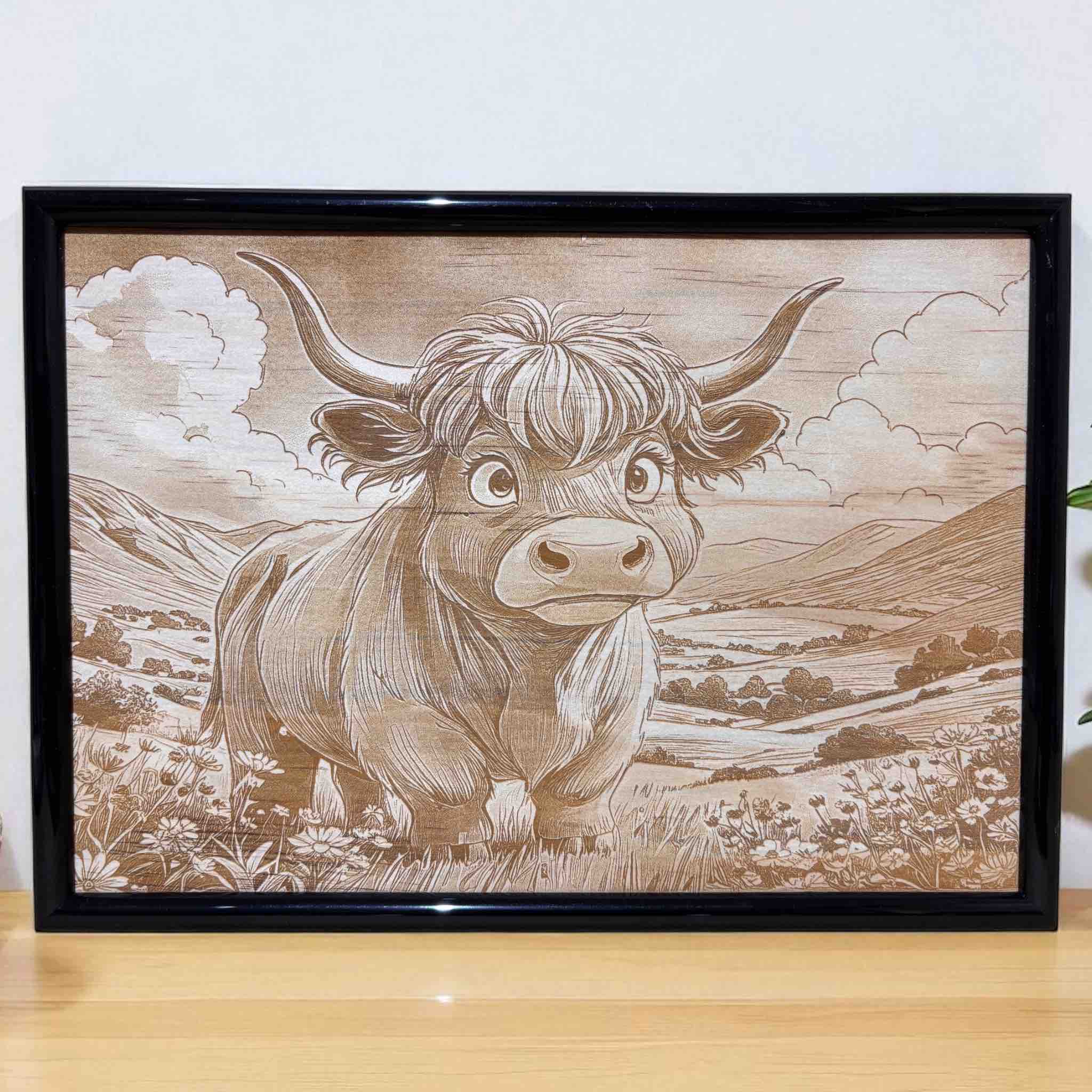 Framed cartoon Highland cow wood art with country landscape, Australian decor by Laser Design Creations.