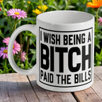 'I Wish Being A Bitch Paid The Bills' ceramic mug by Laser Design Creations, featuring bold black text on a white background.