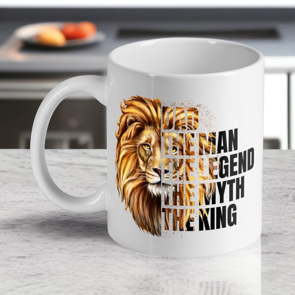 Powerful Lion Quote Dad ceramic mug by Laser Design Creations, featuring a bold, illustrative lion head graphic and the quote DAD THE MAN THE LEGEND THE MYTH THE KING.