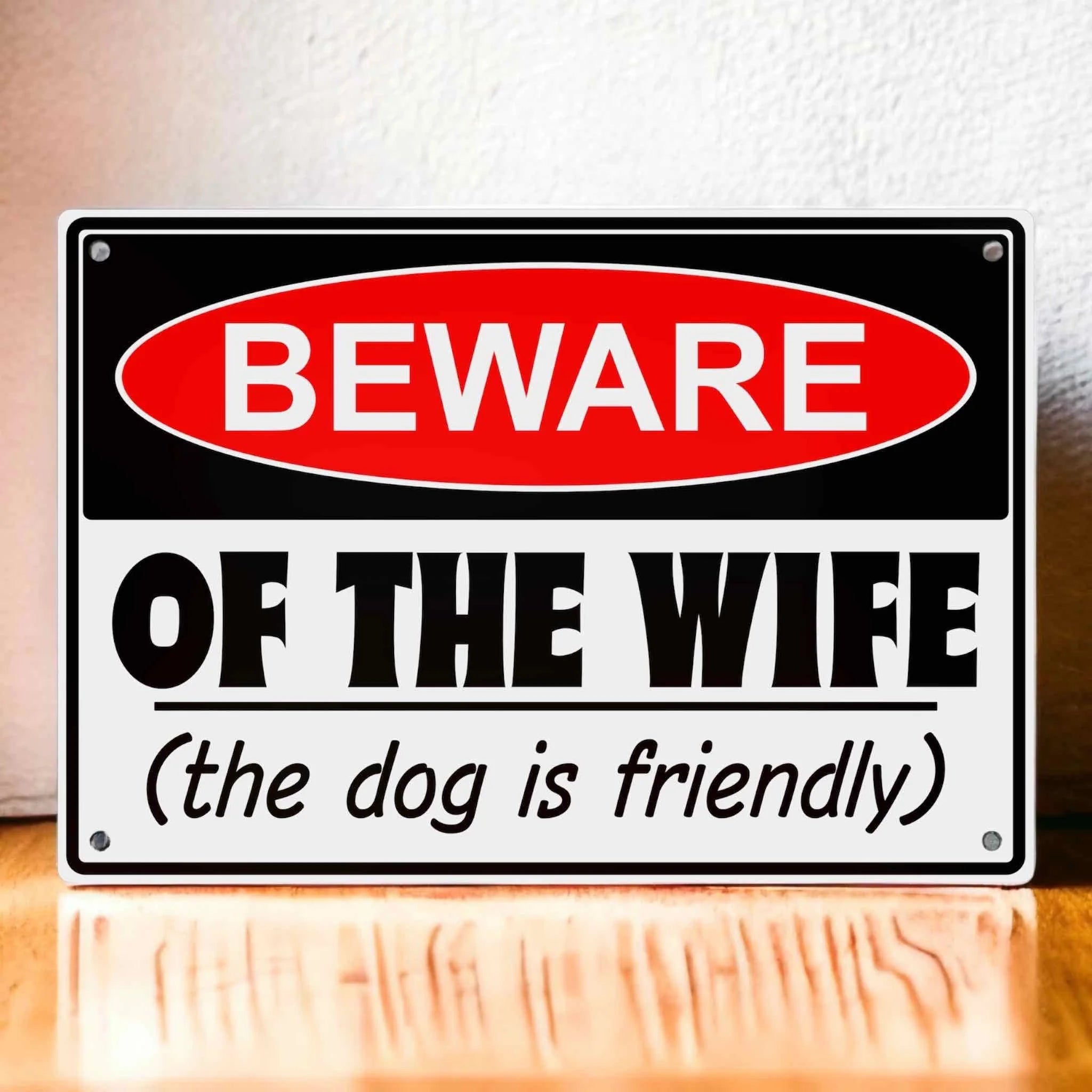 Funny Beware Of The Wife the dog is friendly Warning Aluminium Sign by Laser Design Creations, featuring bold, caution-style text for a humorous marital joke.