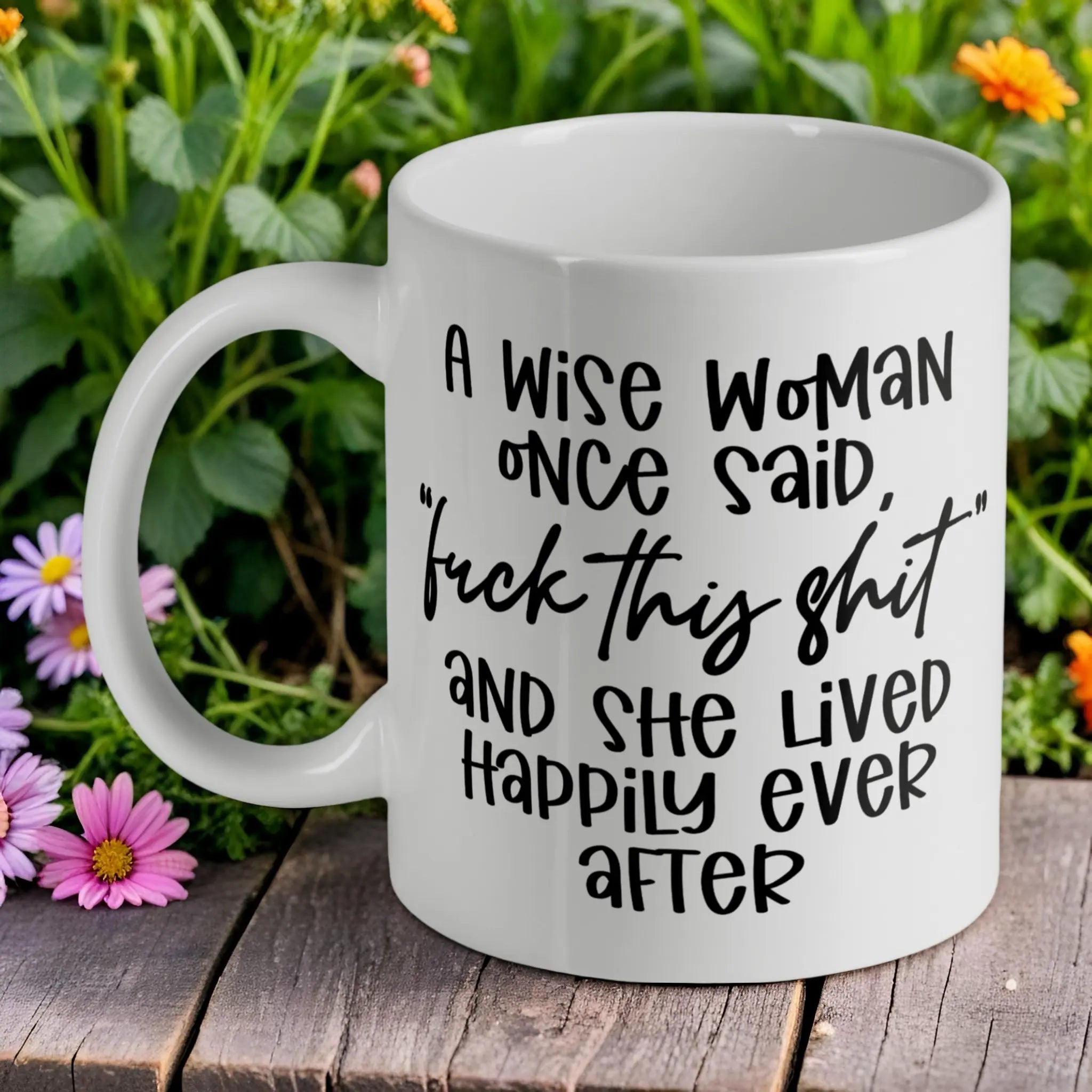 Wise Woman Said F*ck This Shit ceramic mug by Laser Design Creations, featuring a funny sarcastic quote about living happily ever after.