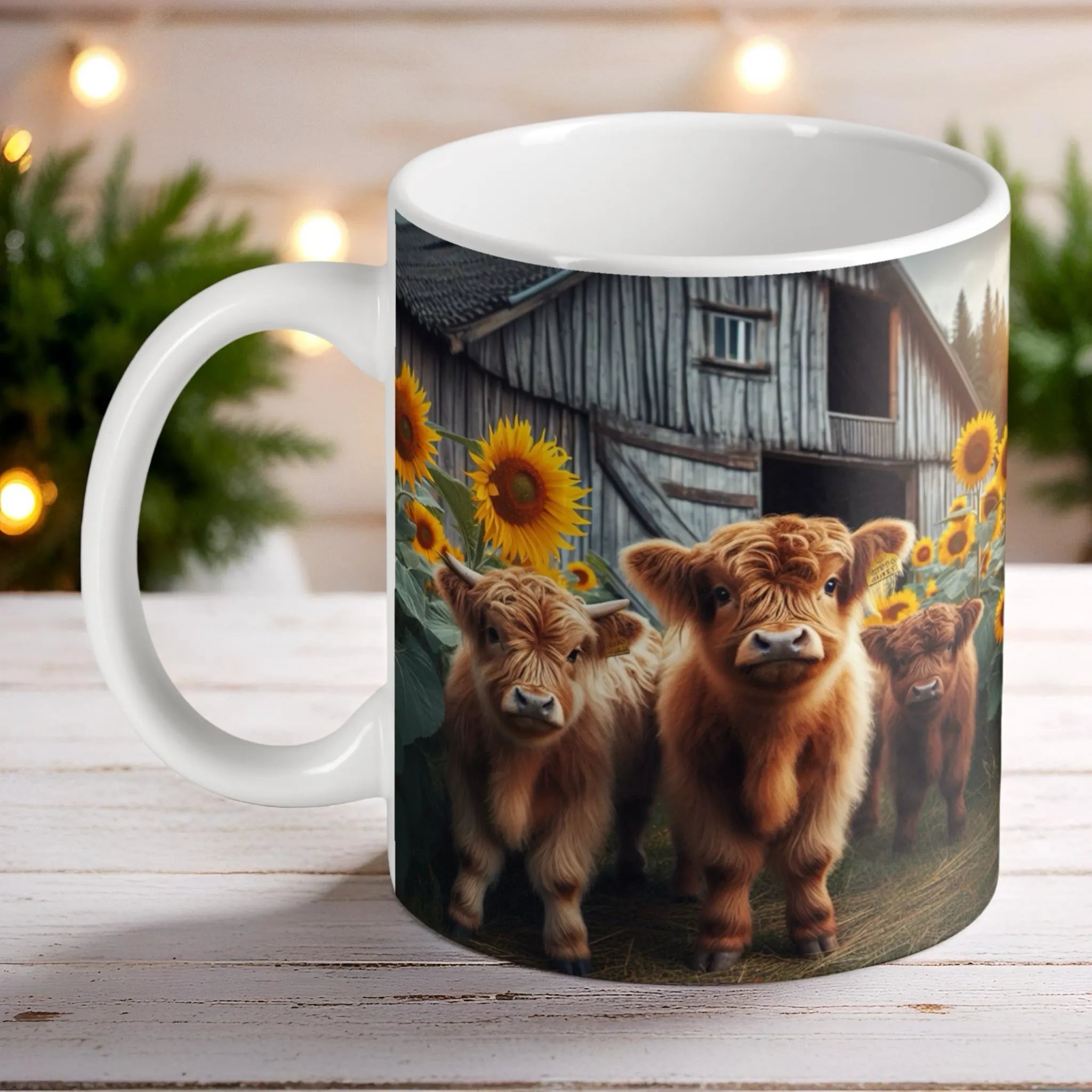 Adorable Baby Highland Cows & Barn ceramic mug by Laser Design Creations, featuring three fluffy Highland calves sitting in front of a rustic barn with bright yellow sunflowers.