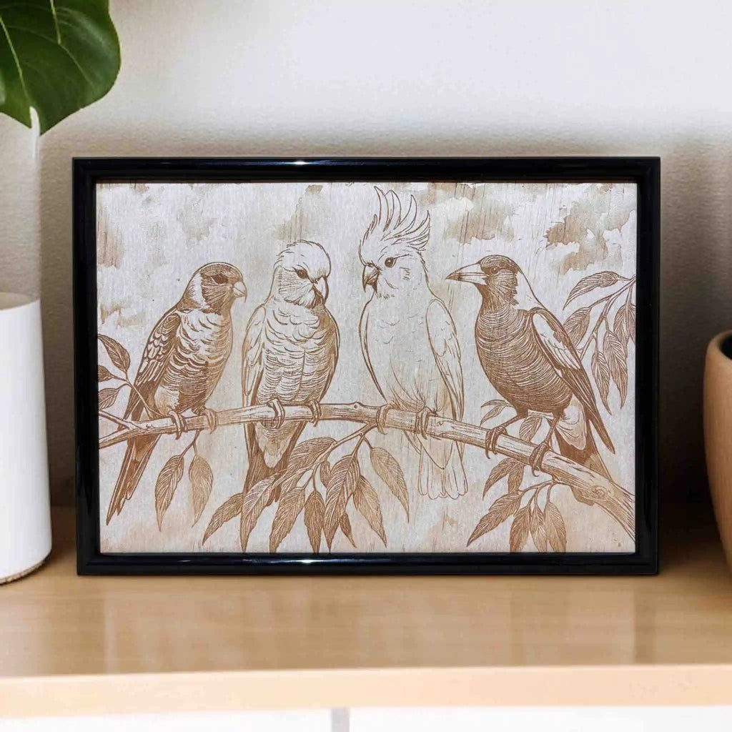 Laser engraved wood art featuring a lorikeet, galah, cockatoo, and magpie on a branch, Australian decor by Laser Design Creations.
