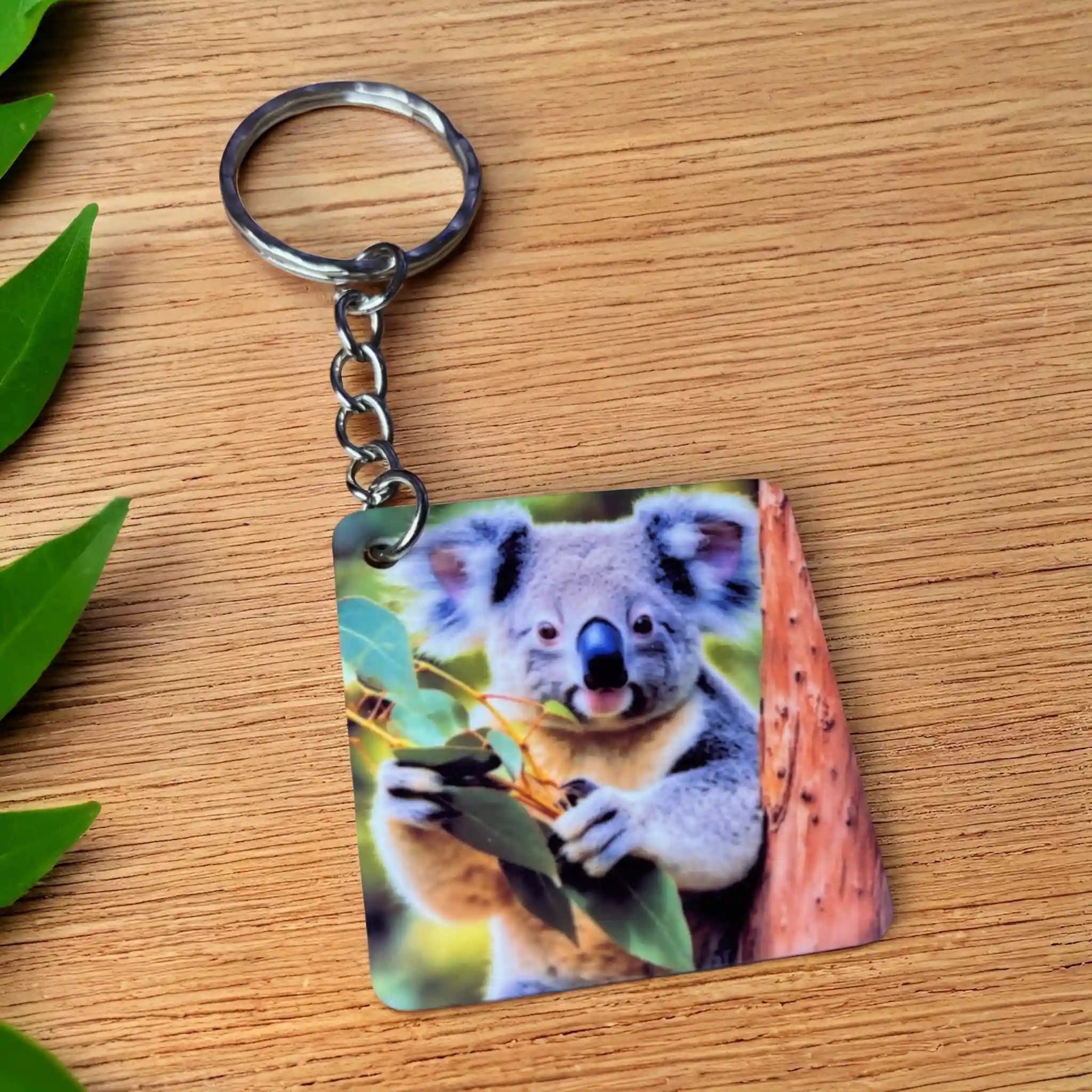 Sweet Eucalyptus Koala keyring, showcasing a realistic fluffy koala nestled in a eucalyptus tree by Laser Design Creations.