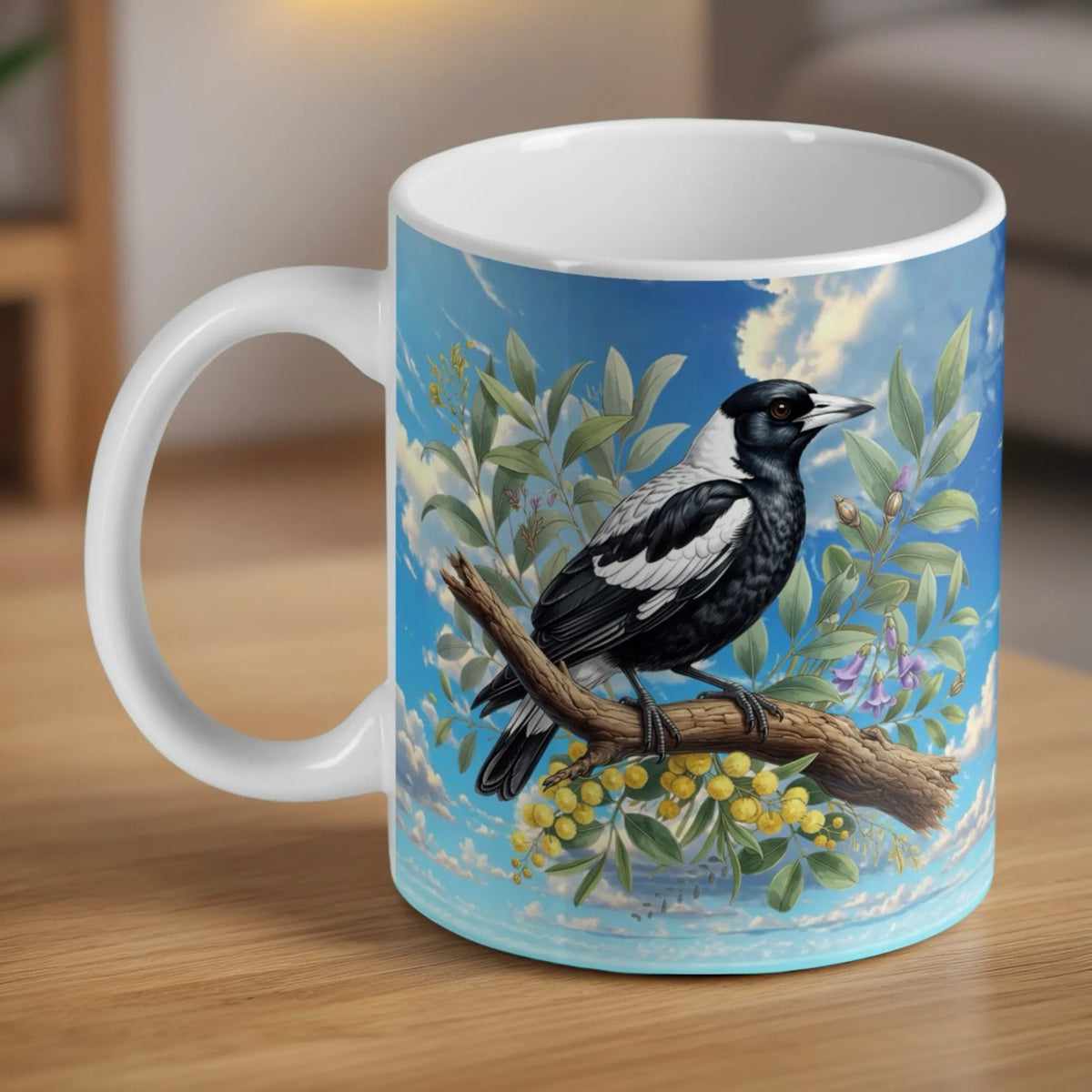 Watercolour Australian Magpie ceramic mug by Laser Design Creations, featuring an iconic native bird resting amongst yellow wattle blooms and soft botanical greenery.