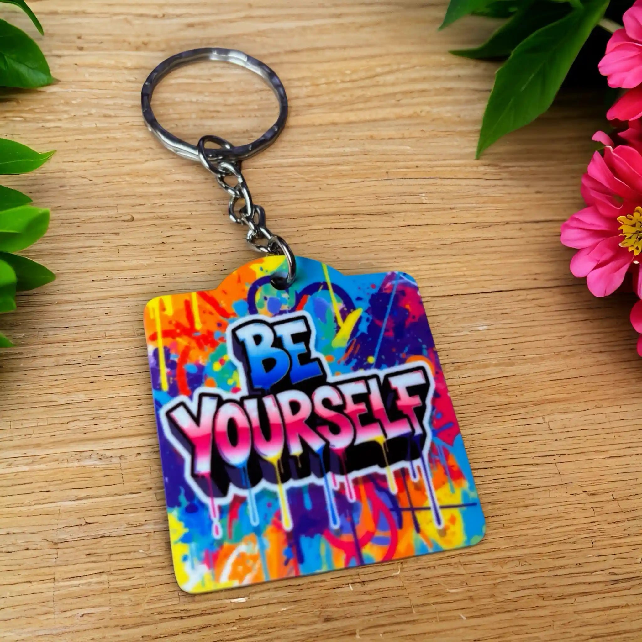 Bold Graffiti Splatter BE YOURSELF Quote acrylic keyring, showcasing vibrant street art typography and paint drip accents by Laser Design Creations.