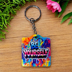 Bold Graffiti Splatter Be Yourself Quote acrylic keyring by Laser Design Creations, featuring the motivational BE YOURSELF text and a vibrant street art background.