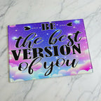 Pastel cloud motivational quote glass chopping board from Laser Design Creations featuring the inspirational quote BE the best VERSION of you set against a vibrant pastel cloudscape.