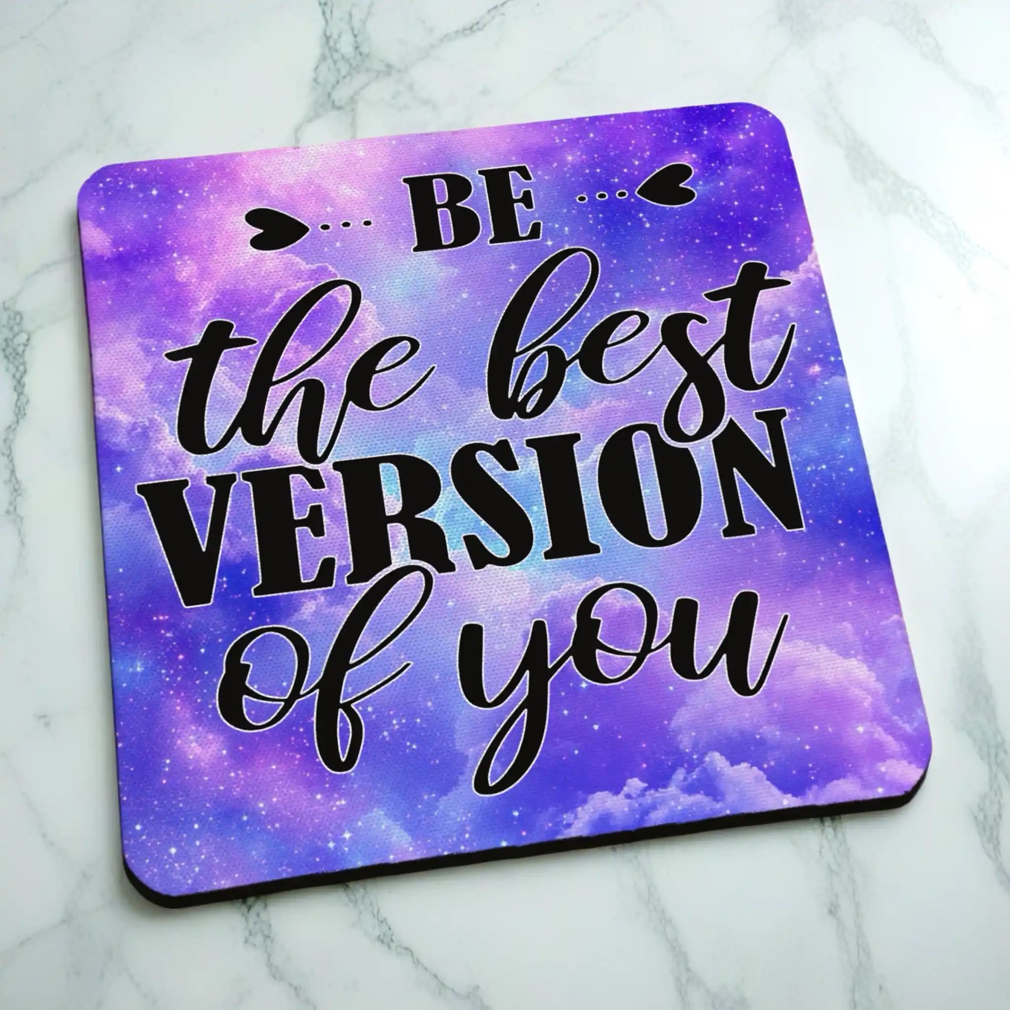 Side view of Be The Best Version Of You Purple Galaxy Art neoprene coaster with the edge detail of the cosmic purple stardust pattern, by Laser Design Creations.