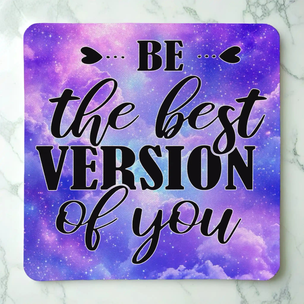 Top view of Be The Best Version Of You Purple Galaxy Art neoprene coaster with the motivational quote "BE... the best VERSION of you" amidst a deep purple and blue space background, by Laser Design Creations.