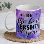 Be The Best Version Of You Purple Galaxy Art ceramic mug by Laser Design Creations, featuring the inspirational quote "BE... the best VERSION of you" against a vibrant purple cosmic galaxy and space nebula background.