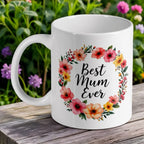 'Best Mum Ever' ceramic mug by Laser Design Creations, featuring the text inside a watercolour floral wreath.