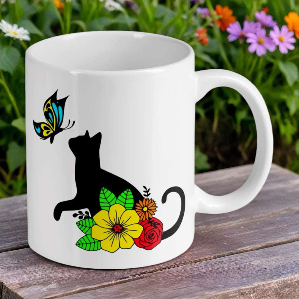 Reverse side of Cat and Butterfly floral ceramic mug by Laser Design Creations, featuring a black cat silhouette amongst colourful flowers.