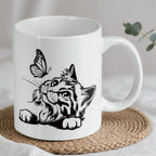 Reverse side of Cat and butterfly line art ceramic mug, showcasing the wrap-around artwork by Laser Design Creations.