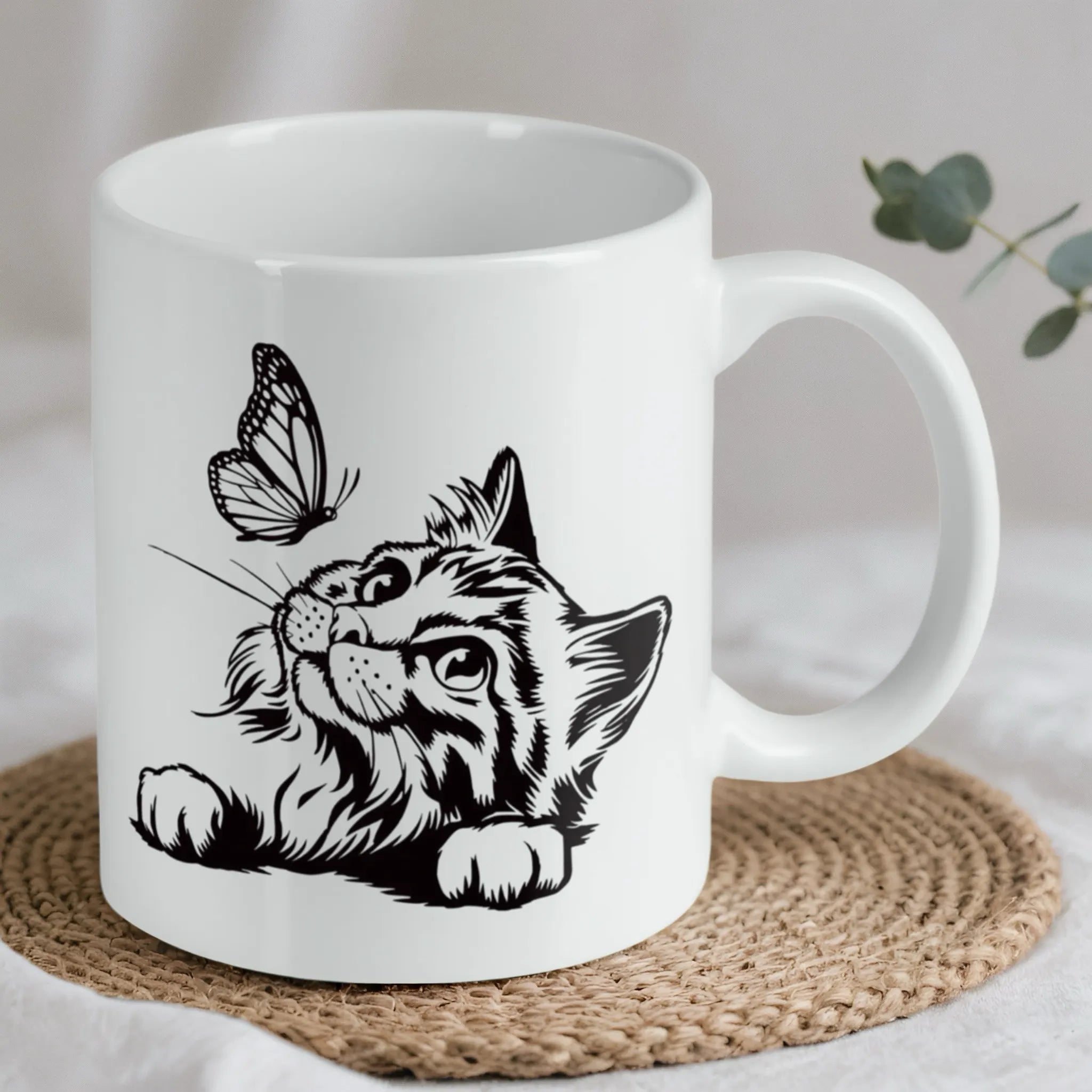 Reverse side of Cat and butterfly line art ceramic mug, showcasing the wrap-around artwork by Laser Design Creations.