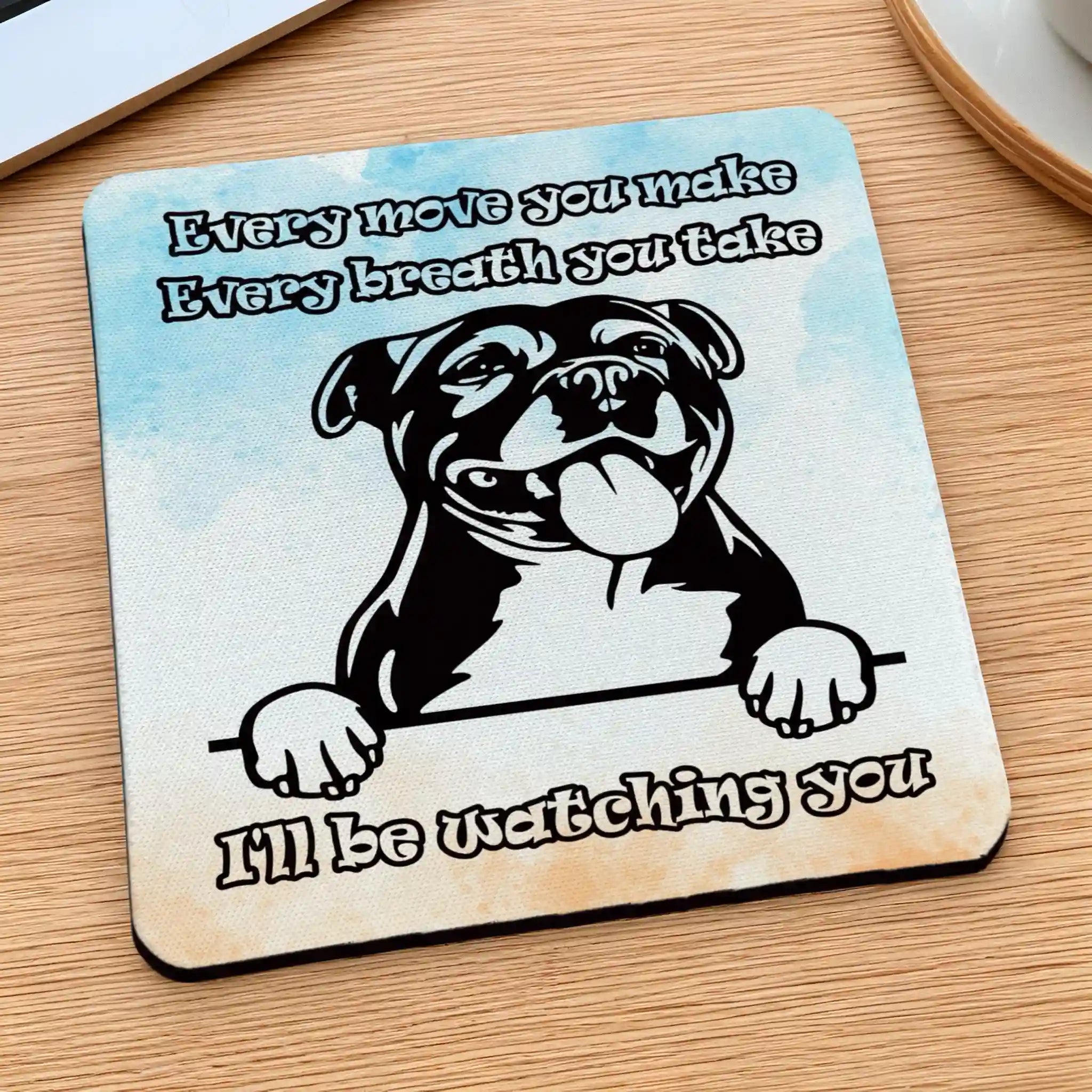 Side view of a Cheeky Staffy "I'll Be Watching You" neoprene coaster with a Staffy face and quote, by Laser Design Creations.