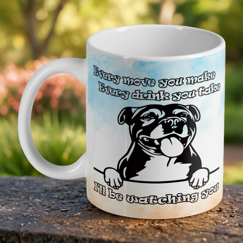 Cheeky Staffy "I'll Be Watching You" ceramic mug by Laser Design Creations, featuring a Staffy face with its tongue out and a funny text overlay.